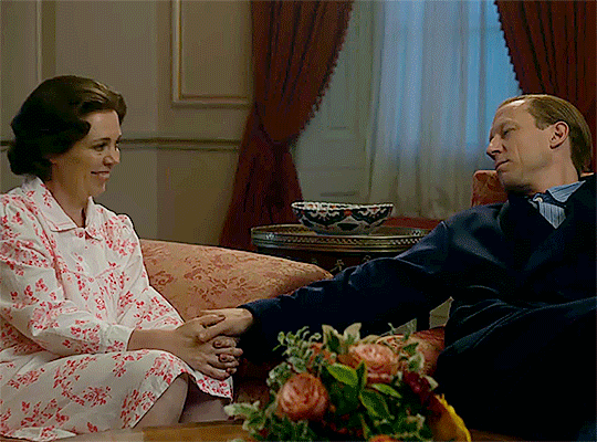 Middle-aged Philip's care, reassurance and concern for his wife continued to be felt throughout Tobias Menzies & Olivia Colman's stint as the Queen & Prince Philip. He is shown here earnestly stroking her hand with his thumb as she beams at him adoringly.