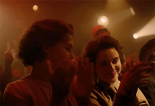 After some raucous partying, Elizabeth tenderly sinks against her sister, as they both clap for the band.