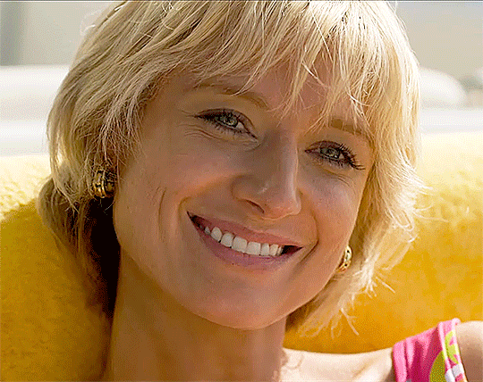 Princess Diana (Elizabeth Debicki) is in a flirty mood, laughing and smiling during her summer holidays on board a yacht.