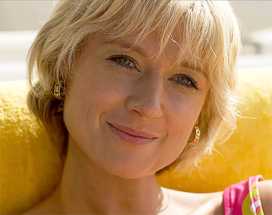 Diana (Elizabeth Debicki) winks and smiles very cutely towards her boyfriend Dodi (off-camera)